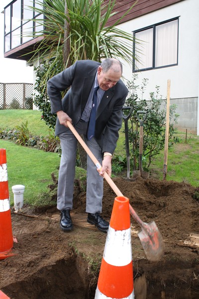 Mayor Neil Tiller helps connect the first property in Mangawhai to the EcoCare system